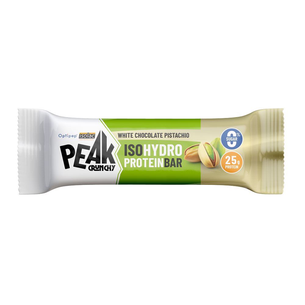 Barretta proteica Peak gusto cioccolato bianco e pistacchio Barretta proteica Peak Crunchy IsoHydro al gusto cioccolato bianco e pistacchio su sfondo bianco.